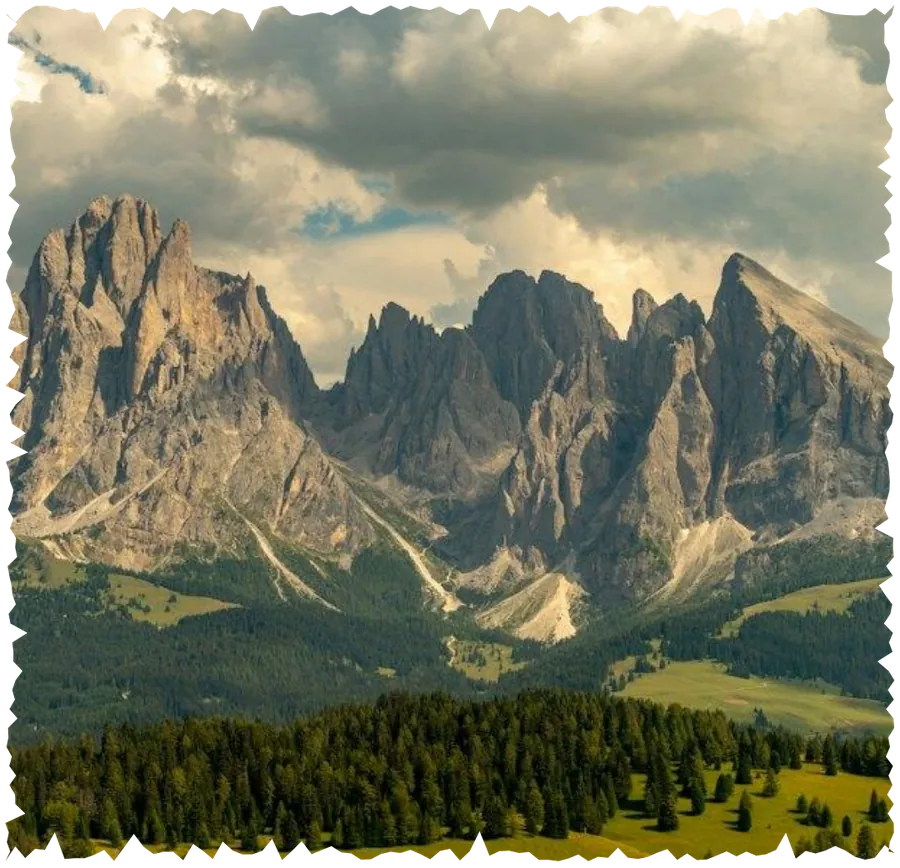 Dolomites peaks above an alpine meadow