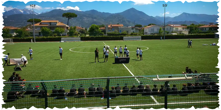 Buffon Football Academy camp on a pitch with mountains behind