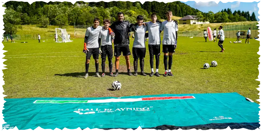 Young goalkeepers with their coach at a Buffon Football Academy camp